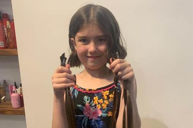 Libby has donated 12 inches of hair to charity.