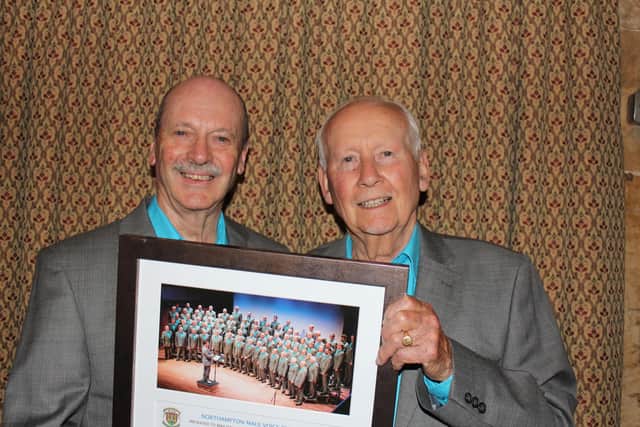 Mike Davis (right) holding Honorary Life Membership Award in 2019 presented to him by the then NMVC Chairman, John Waller (left).
