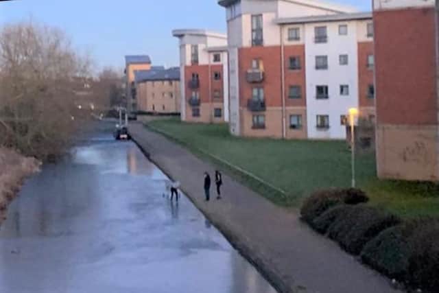 People were seen walking on a frozen canal in Northampton. This has sparked firefighters to issue a warning. Photo: NFRS.