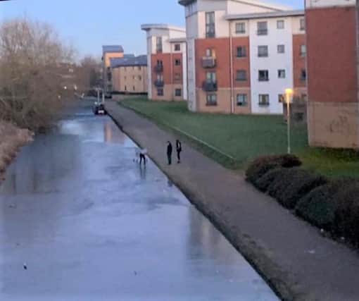 People were seen walking on a frozen canal in Northampton. This has sparked firefighters to issue a warning. Photo: NFRS.