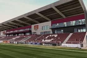Cobblers owners say a deal to buy land around Sixfields includes a pledge to complete the eyesore East Stand