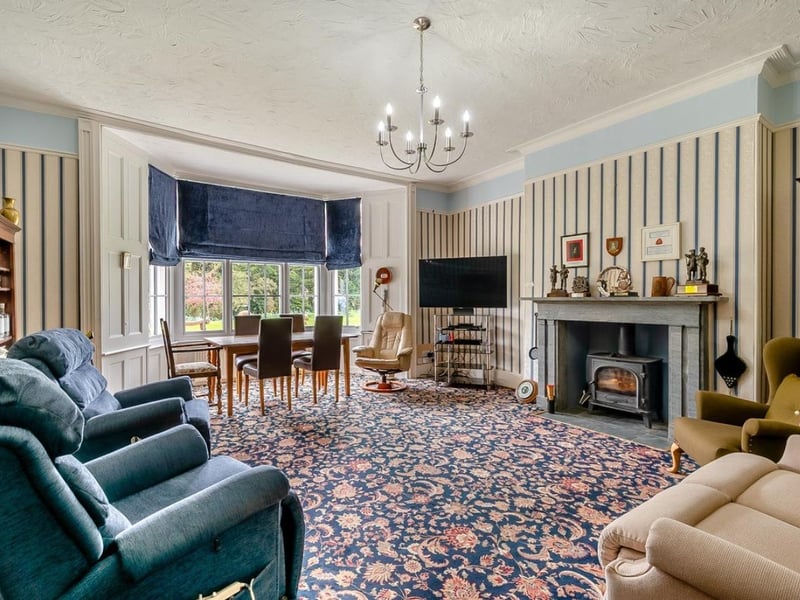 Here is one of the four reception rooms, this one has a dining room in the perfect position for looking out across the garden