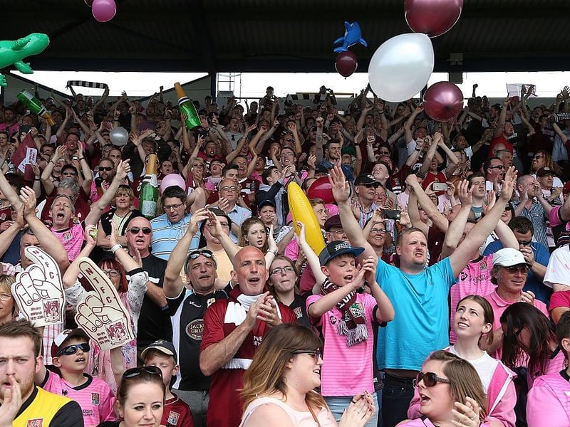 Northampton Town fans welcome there team on the pitch prior to the Sky Bet League Two match between Portsmouth and Northampton Town at Fratton Park on May 7, 2016.