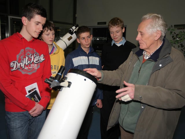 Beginners, amateur astronomers and professional stargazers exploring the night sky at an event at The Duston School. Pictured: Students from The Duston School Ben Kelly, 11, Hanna Lorenz, 11, Thomas Collett, 12, Emmanuel Hlouverakis, 14, Joseph Bushnell, 12, Daniel Hlouverakis, 12 and Blake Robinson, 12, speaking to Stuart Cooper from Northamptonshire Natural History Society Astronomy section.