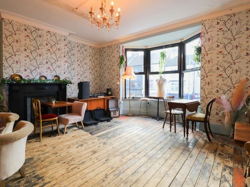 The elegant drawing room on the first floor includes a large bay window which ushers in light