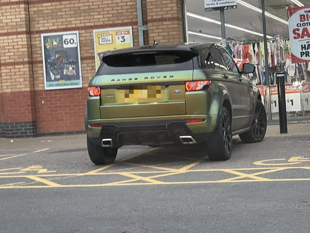 'Parking in the middle of two disabled bays'