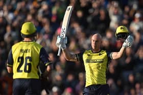 Chris Lynn celebrates reaching his century against the Steelbacks