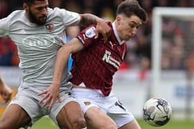 Kieron Bowie battles for possession during the Cobblers' clash with Exeter City at Sixfields on Saturday (Picture: Pete Norton)