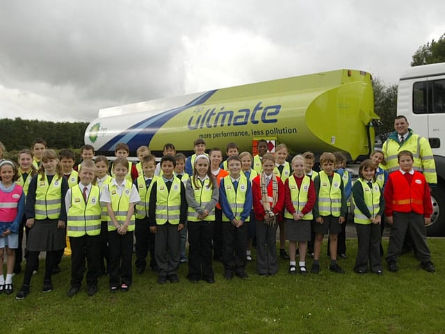 Road safety scheme launch at Ecton Brook Primary School, sponsored by BP. Pictured: Dave Dunne, Northampton terminal shift supervisor at BP and Deryn Smith, safety advisor from BP head office, with children from Northamptonshire schools who have been selected to be Junior Road Safety Officers.