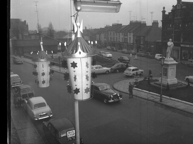 Christmas decorations in Abington Square, Northampton with Bradlaugh statue early 1960s