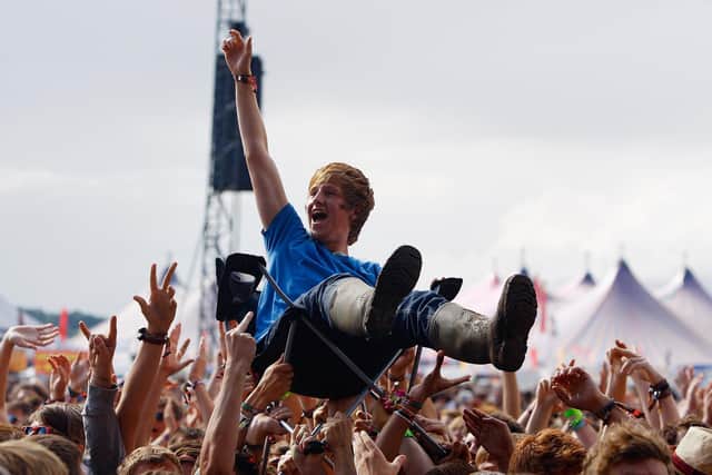 A music fan crowd surfs on a camping chair at Reading Festival (Photo by Simone Joyner/Getty Images)