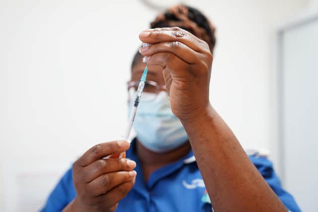 A nurse prepares a dose of a Covid-19 vaccine (Photo by  Jacob King - WPA Pool / Getty Images)