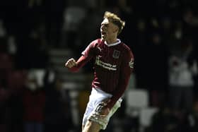 Mitch Pinnock leaps in jubilation after wrapping up all three points with a thumping late strike against Fleetwood Town.