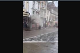 Smoke was seen pouring from the building as people ran for safety