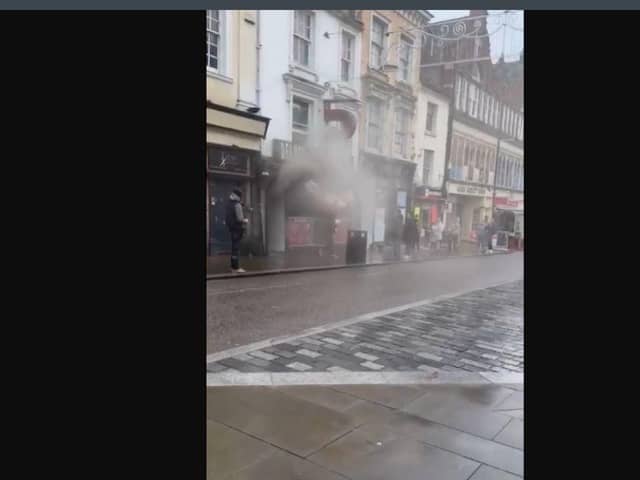 Smoke was seen pouring from the building as people ran for safety