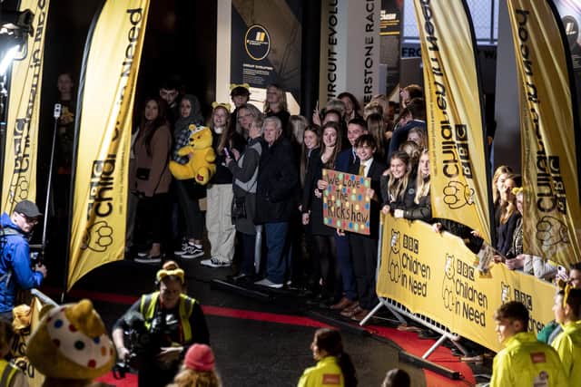Tabatha's friends and family cheer as she crosses the finish line for Children in Need