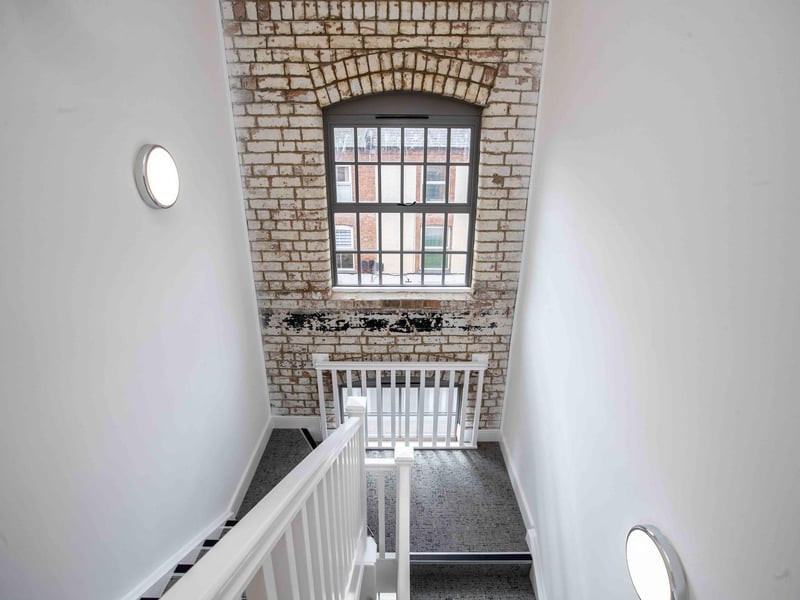 The Grade II listed former shoe factory has been converted into 89 stylish apartments by the OEH Group