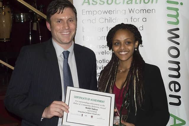 Bethel Tadesse winning a YBA award in the police and community relations category in 2015.