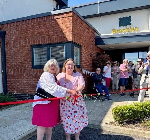 Cllr Elaine Wiltshire, along with Brackley Care Home Manager Stephanie Eley cut the ribbon to declare the event open