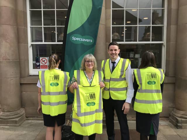 Sue Hamilton, NCFWI Media member, with Stefano De Leo, Retail Director, and Specsavers staff.