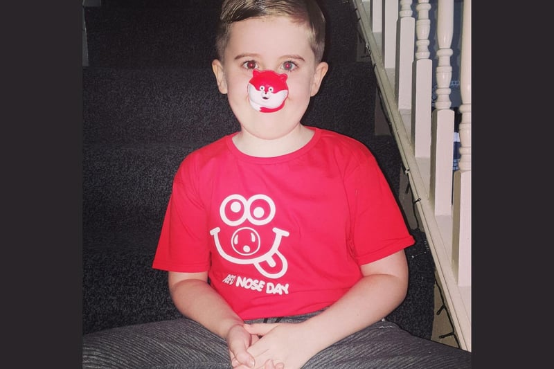 A red nose and a red t-shirt to match!
