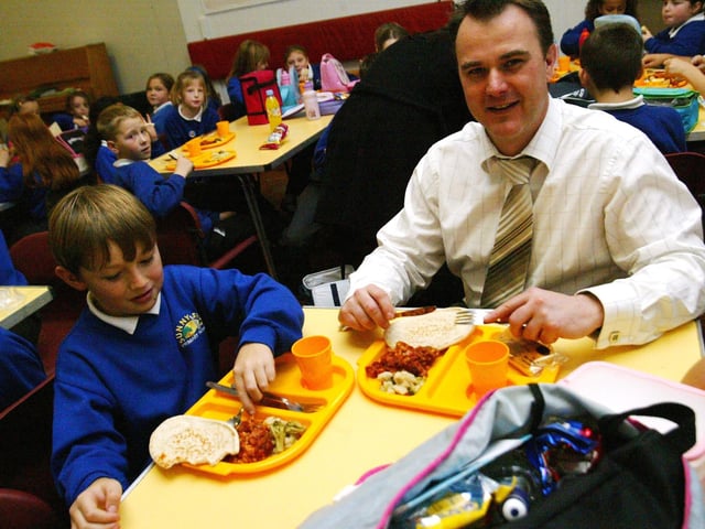 Sunnyside Primary School, head teacher with pupils in canteen / lunch hall