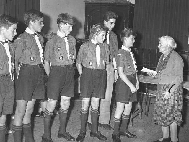 This image shows a Scout group in Northampton welcoming a special guest