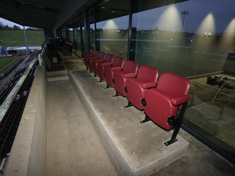 The seats are going in outside the executive boxes