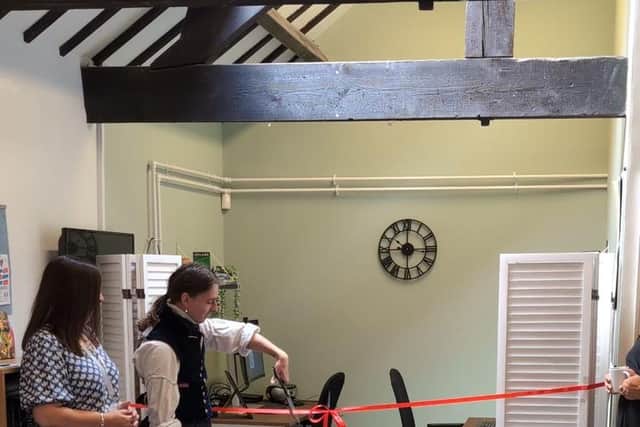Care Experienced Orin cuts the ribbon on the new suite at Russell House