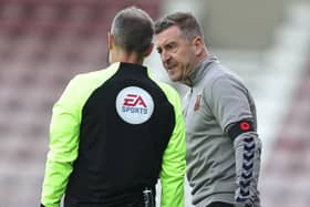 Cobblers manager Jon Brady makes a point to fourth official Robert Lewis during Saturday's draw with Newport County (Picture: Pete Norton/Getty Images)