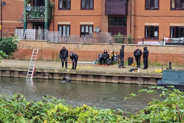 Police divers search River Nene as Northampton murder probe enters day four. Credit: Logan MacLeod