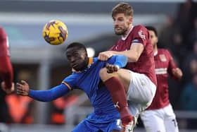 Cobblers skipper Jon Guthrie battles for the ball with Shrewsbury Town striker Dan Udoh at Sixfields on Saturday (Photo by Pete Norton/Getty Images)