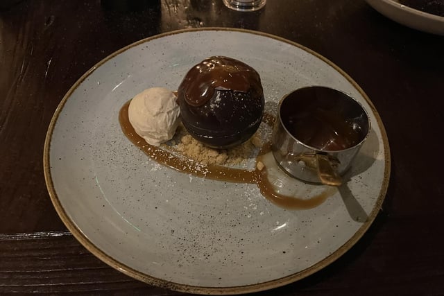 Chocolate bomb with chocolate brownie, Biscoff spread, vanilla ice cream, hot toffee sauce.