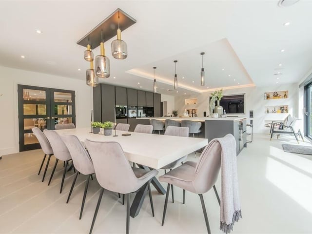 A hugely sociable kitchen diner boasts an island breakfast bar and also has a family lounge at one end