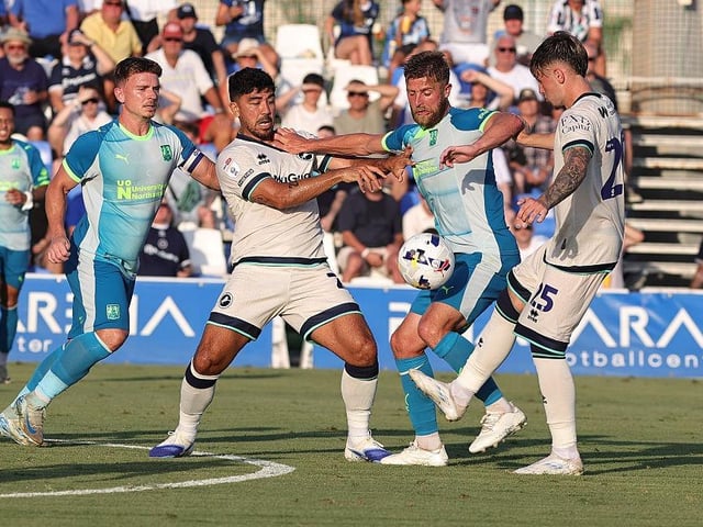 Michael Jacobs tries to find a way past Massimo Luongo and Luke Cundle
