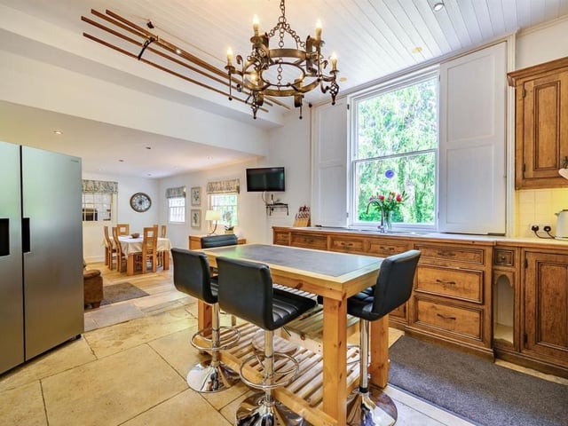 This Victorian home has a tennis court, huge gardens and a private mooring on the River Nene.