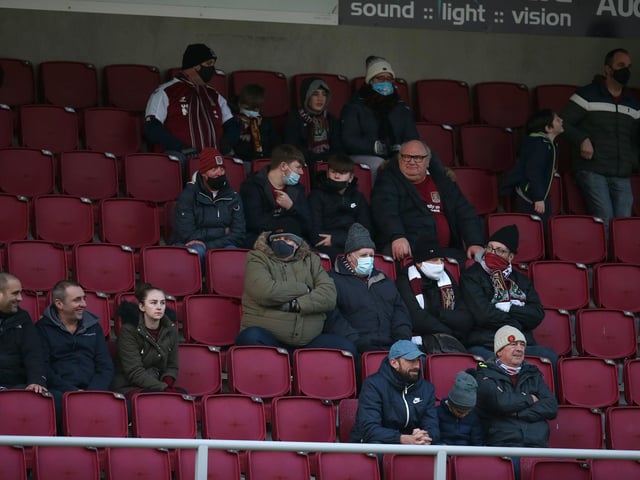 2020: Northampton Town fans return to watch their team for the first game since 07.03.20 due to the coronavirus pandemic during the Sky Bet League One match between Northampton Town and Doncaster Rovers at PTS Academy Stadium on December 05, 2020 in Northampton, England. (Photo by Pete Norton/Getty Images)