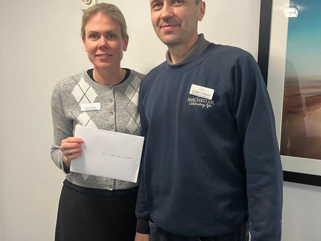 General Manager Elina House presents the £100 voucher to the homes maintenance Assistant Serghei