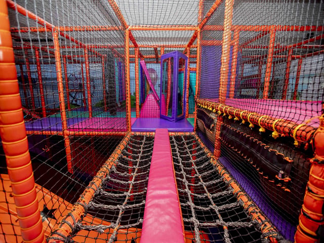 There is a new sensory room, car wash role play zone, two large ball pits with ball showers, and a sports court with astroturf on the top level.