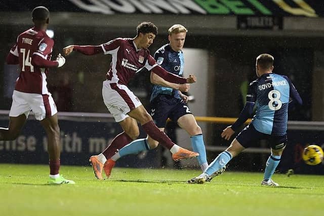 Ethan Wheatley lets fly in the first half against Wycombe.