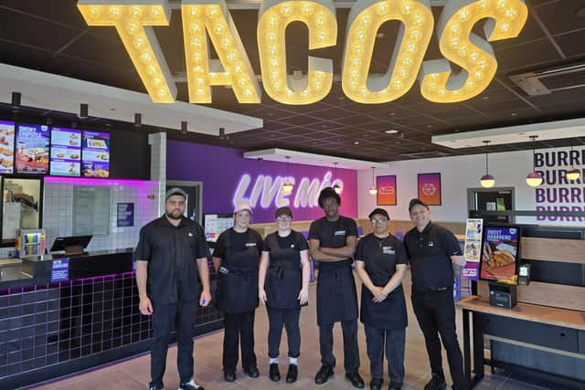Taco Bell Kettering team members on the opening day with left Gabriel Bradu manager and area manager Russell Mayes on right /IMG