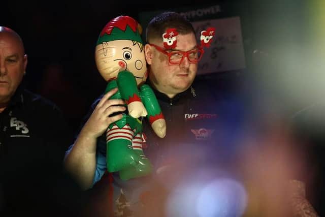Ricky Evans got the Ally Pally crowd in the festive spirit with his walk-on