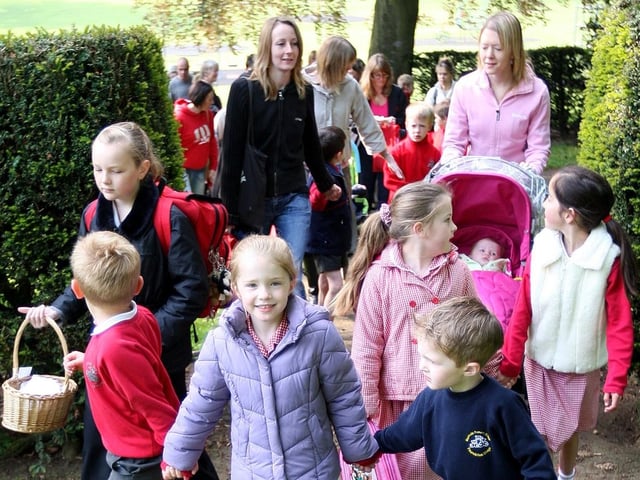 Cedar Road Primary School pupils, parents and staff walking from Abington Park playground to school as part of 'Walk To School' week.