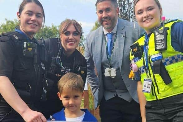PC Jemma Barclay, PC Polly Scott, Principal Peter Fairbrother, PCSO Rose Turner and Mark at the front