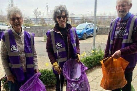 Conrad Woolley (on the right) counting the bags of litter collected