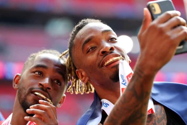 Tariqe Fosu celebrates with Ivan Toney after Brentford's Championship play-off final win over Bournemouth in 2021