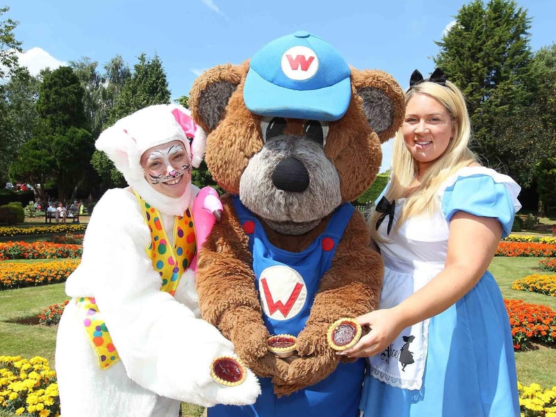 Wicky Bear, The White Rabbit and Alice in the gardens at Wicksteed Park, with jam tarts, as part of an Alice In Wonderland-themed National Playday event /National World