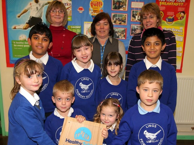 Laura Suffield, headteacher, Liz Mackay, healthy schools advisor for Northampton and Alison Barltrop, school governor, with children from Lings Primary School with their healthy schools award. Pictured in 2008
