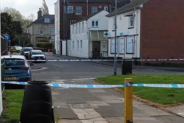 The area around the Barrack Road (in the background) was taped off by police