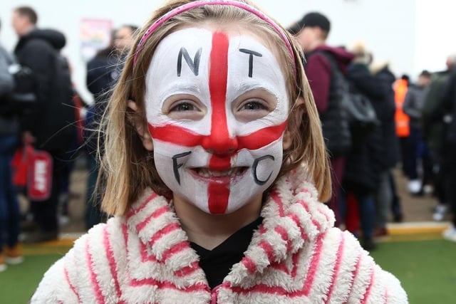 A Young Northampton Town fan with a painted face looks on prior to the Sky Bet League Two match between Northampton Town and Exeter City at PTS Academy Stadium on February 22, 2020.